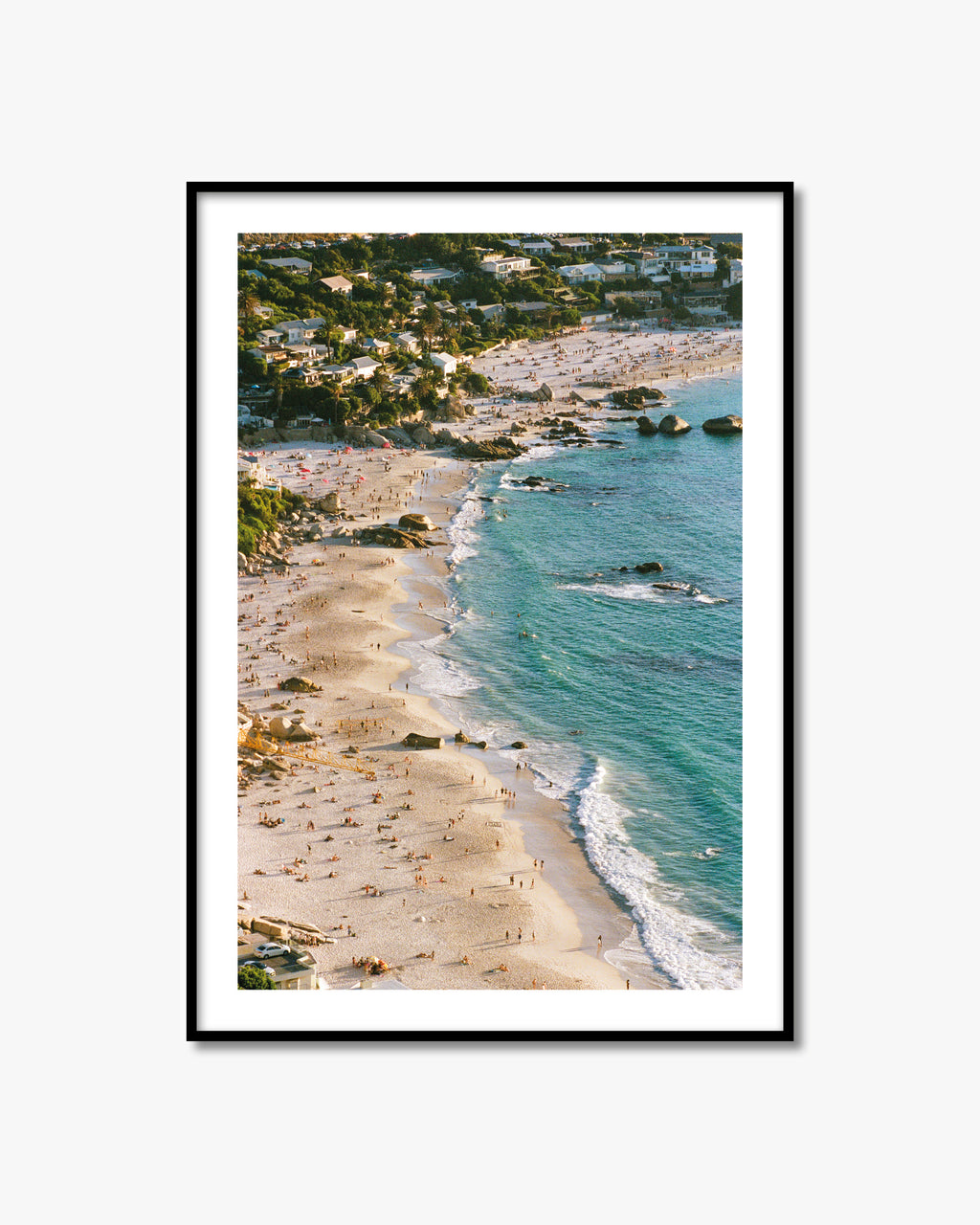 Framed artwork of a beach scene in Cape Town with turquoise water and sandy shore.